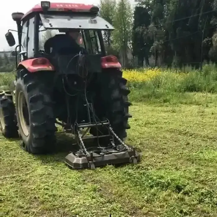 HRM120 compact tractor with loader and mower front mount flail mower